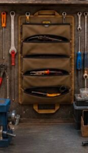 Roll-up tool bag organizer holding hand tools and accessories for easy storage and transport.