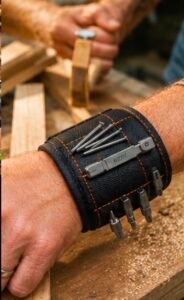 Man wearing a magnetic wristband that holds screws, nails, and drill bits while working.
